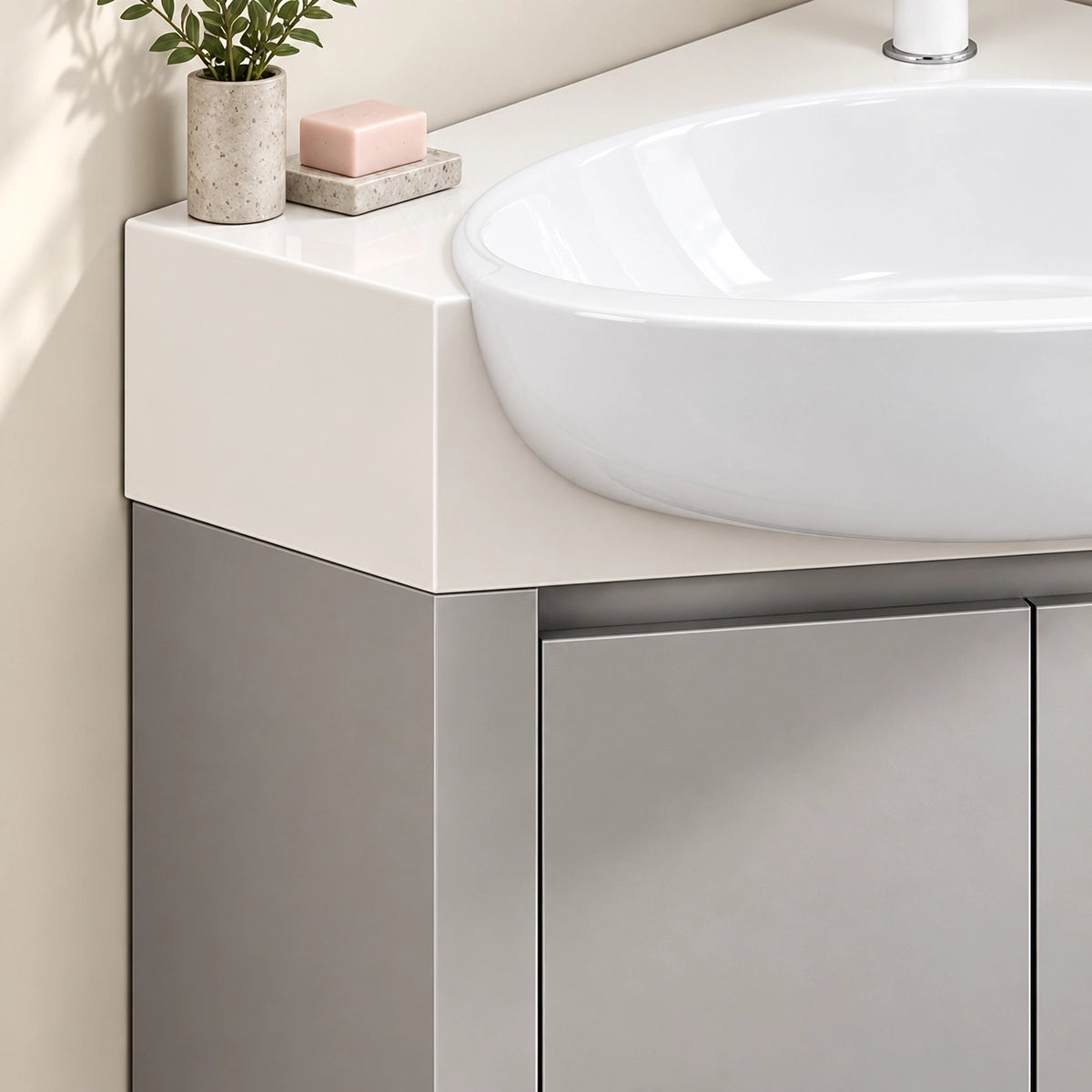 Corner vanity counter close‑up, white countertop with soap and small potted plant