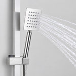 Close‑up of square handheld shower head spraying water with slide bar bracket