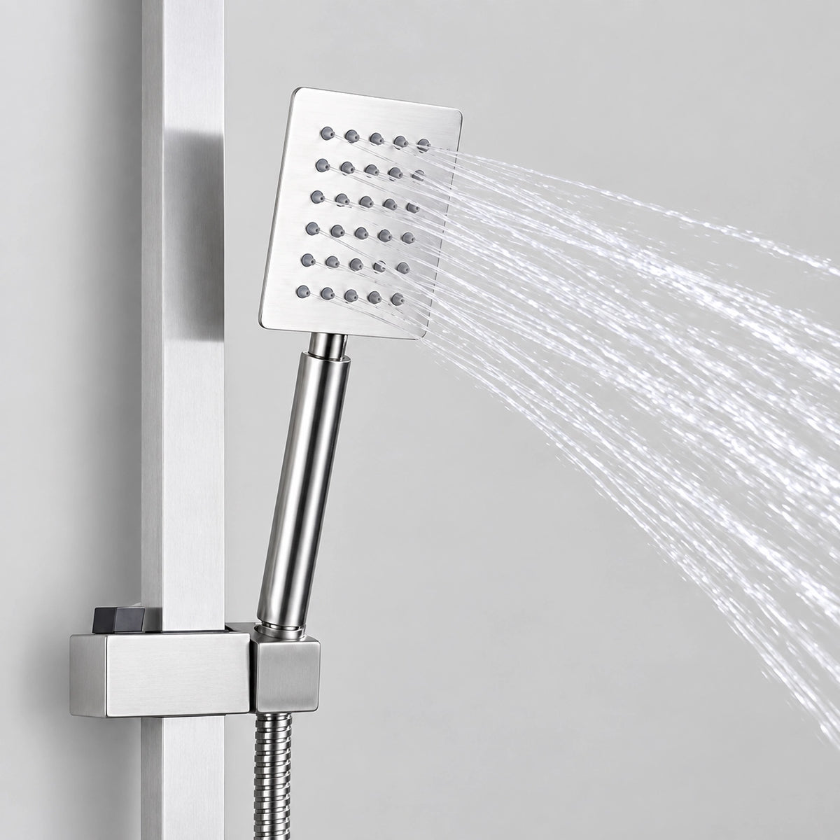 Close‑up of square handheld shower head spraying water with slide bar bracket