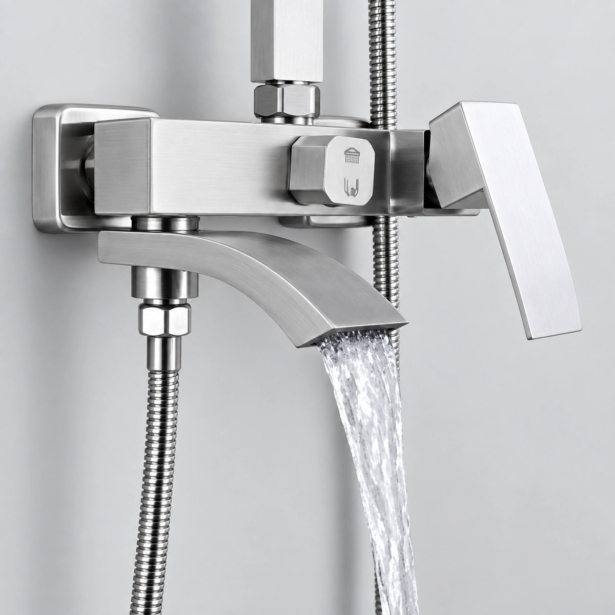Close‑up of water flowing from square shower mixer valve with diverter handle