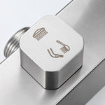 Close‑up of shower diverter knob with 3‑function water outlet icons