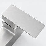Close‑up of square shower faucet handle with fine surface finish