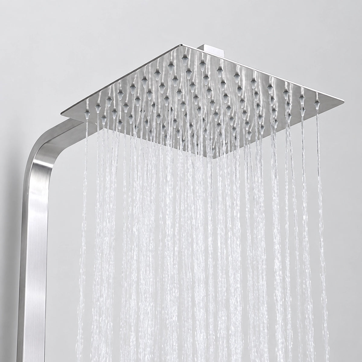 Close‑up of square rain shower head with heavy rainfall water flow