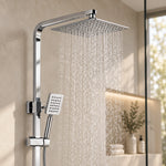 Close‑up of large square rain shower head with flowing water in bathroom
