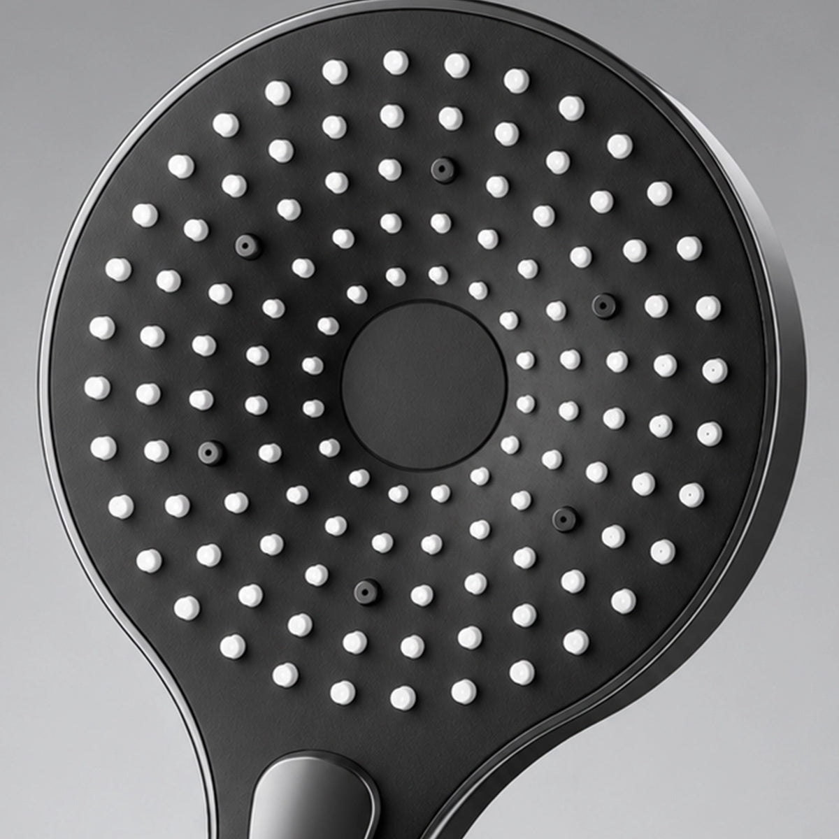 Close‑up of hand shower face with multi‑mode spray holes