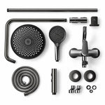 Disassembled shower parts, top‑down flat lay view of all components