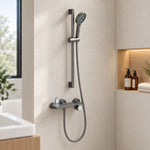 Gunmetal slide bar shower set with shelf, bright tiled bathroom