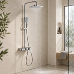 Exposed slide bar shower system in bright full‑view bathroom