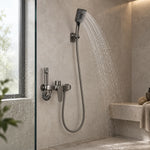 Wall mount shower kit inside bright bathroom with glass partition