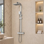 Silver square thermostatic shower set, mounted in herringbone tile shower area