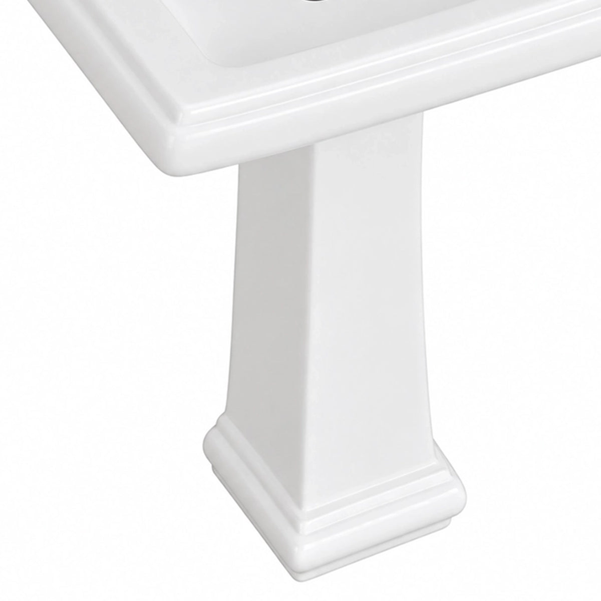 Close-up detail of glossy white ceramic pedestal sink pedestal base with decorative stepped moulding