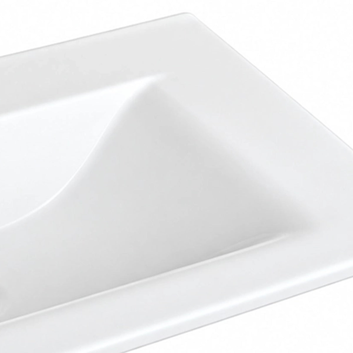 Close-up of glossy white ceramic vanity sink basin, curved interior detail