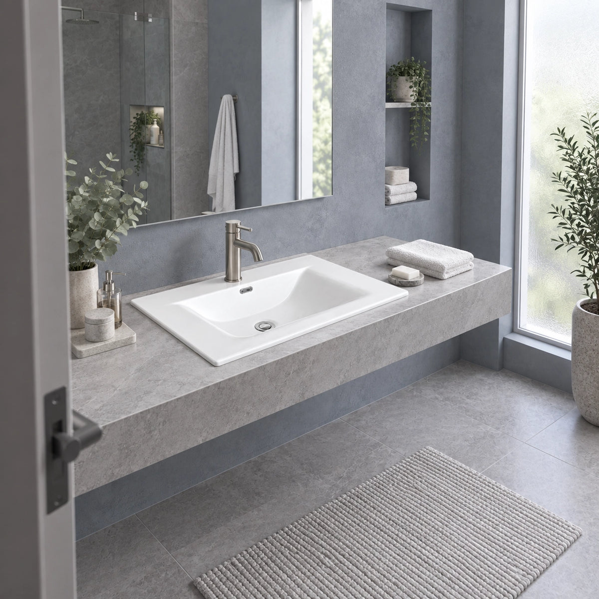 Modern grey bathroom with floating vanity, white sink and natural light