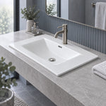 White ceramic vanity sink on grey stone countertop, modern bathroom