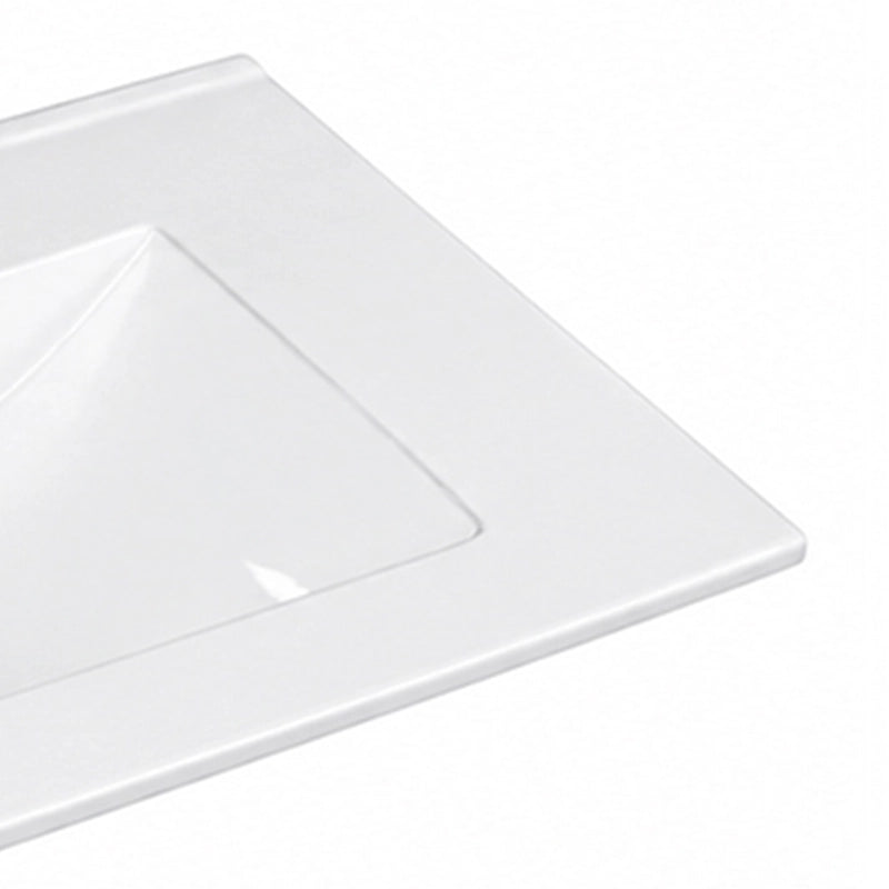 Close-up detail shot of glossy edge of white integrated ceramic vanity sink
