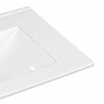 Close-up detail shot of glossy edge of white integrated ceramic vanity sink