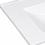 Close-up detail shot of white integrated ceramic vanity sink basin and countertop