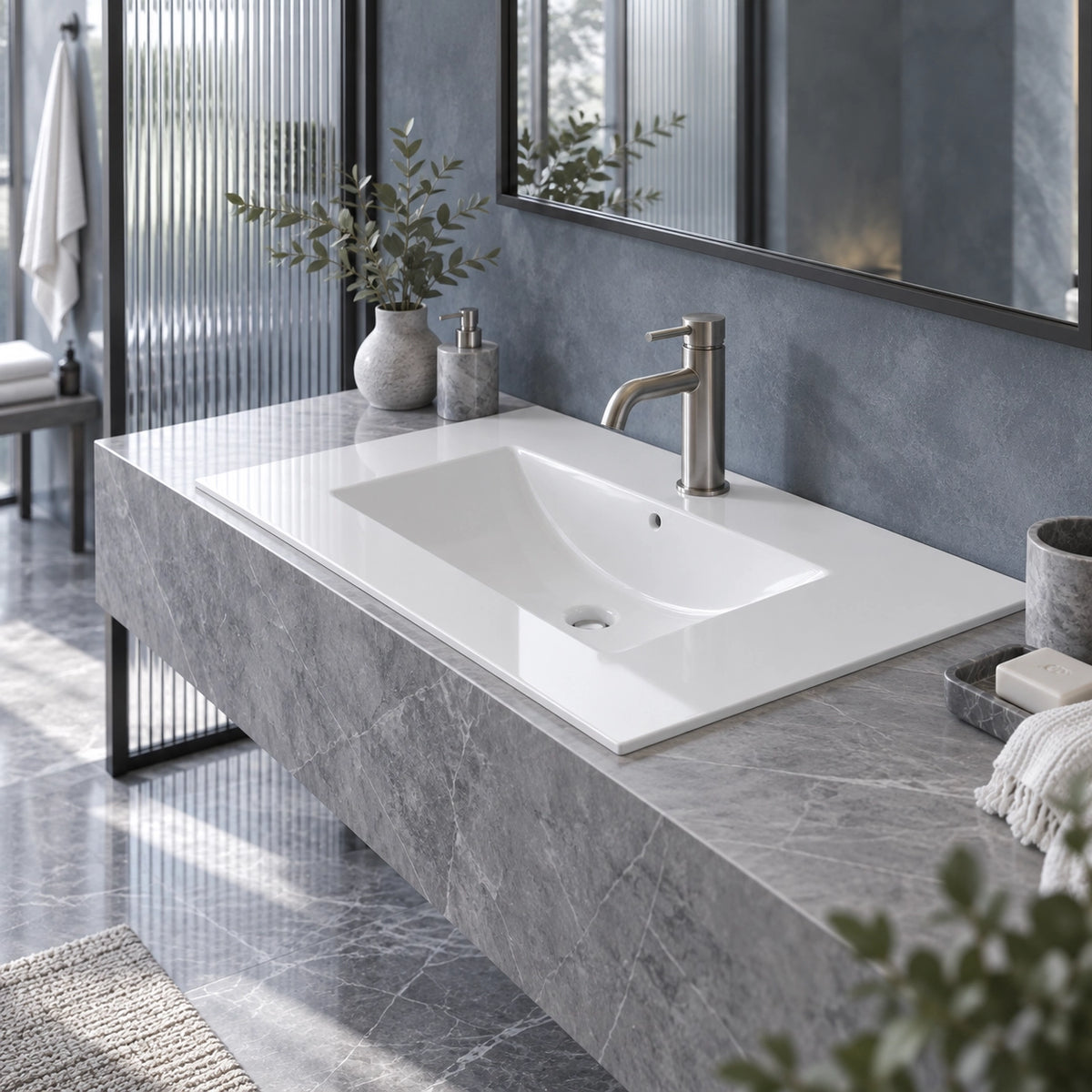 Modern dark bathroom with white integrated vanity sink, grey marble countertop and brushed nickel faucet