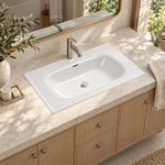 White ceramic oval undermount bathroom sink, bright bathroom lifestyle scene