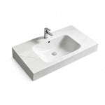 Rectangular sintered stone wall-mount bathroom sink in Fish Maw White, three-quarter view