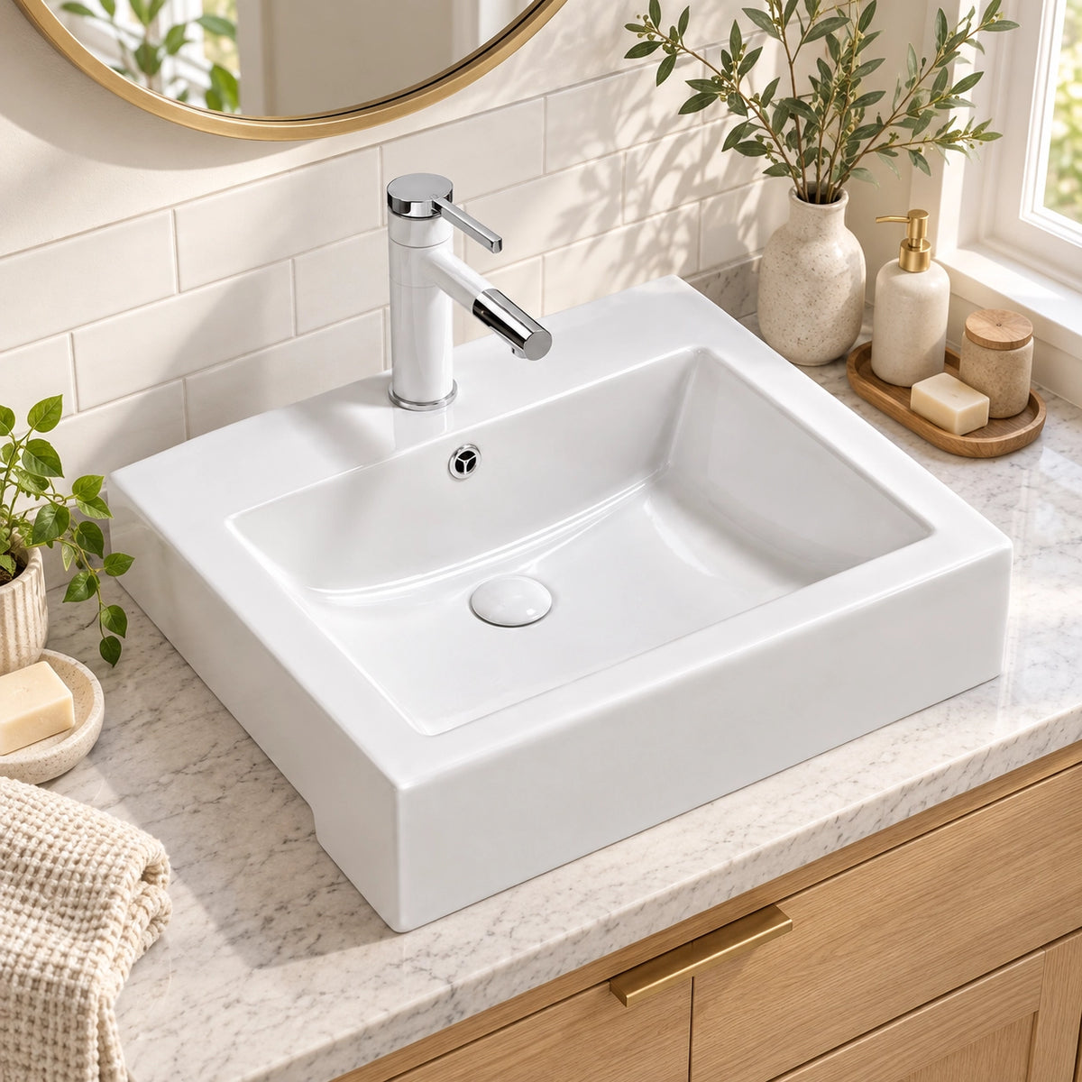 White rectangular ceramic semi-recessed bathroom sink in bright tiled bathroom countertop scene