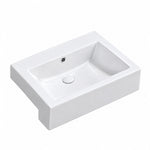 White rectangular ceramic semi-recessed bathroom sink with a single basin, integrated overflow, and glossy white finish.