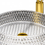 Close-up shot of round diamond-cut clear glass vessel sink showing textured crystal surface 