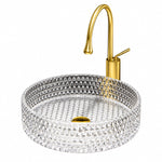 Round diamond textured clear glass vessel bathroom sink with gold faucet, white background