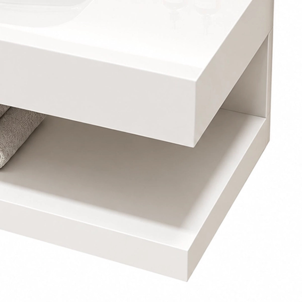 Close-up of open storage shelf and thick solid edge of white floating bathroom vanity