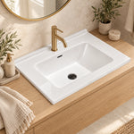 White ceramic rectangular undermount sink, bathroom countertop view