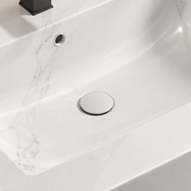 Engineered stone double basin sink close-up, basin drain and surface veining detail