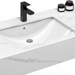 Engineered stone sink basin close-up, integrated basin with matte black faucet