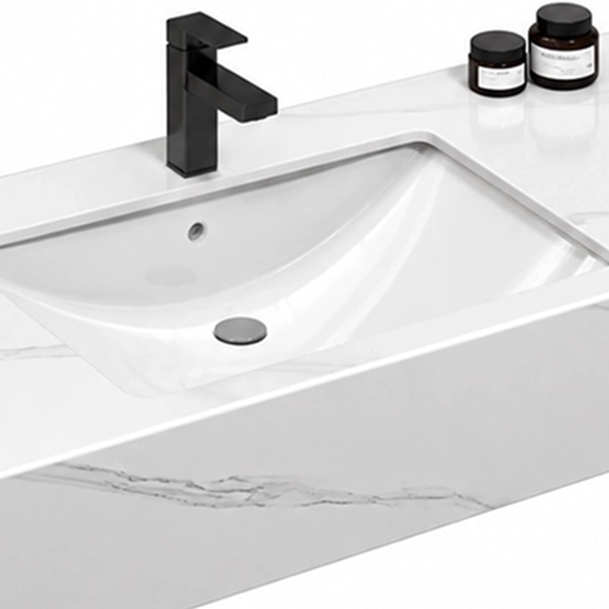 Engineered stone sink basin close-up, integrated basin with matte black faucet