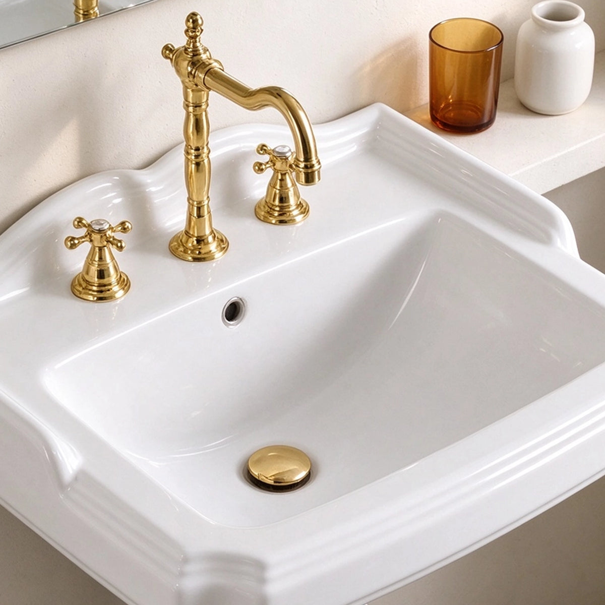 White ceramic rectangular pedestal sink close-up with three-hole faucet and spacious basin