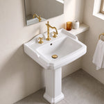 White rectangular pedestal bathroom sink with three-hole faucet and spacious basin
