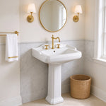 White ceramic pedestal bathroom sink with rectangular basin in an elegant bathroom