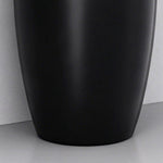 Close-up of the black ceramic pedestal bathroom sink base with a smooth curved design