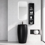 Black ceramic round pedestal bathroom sink in a modern bathroom