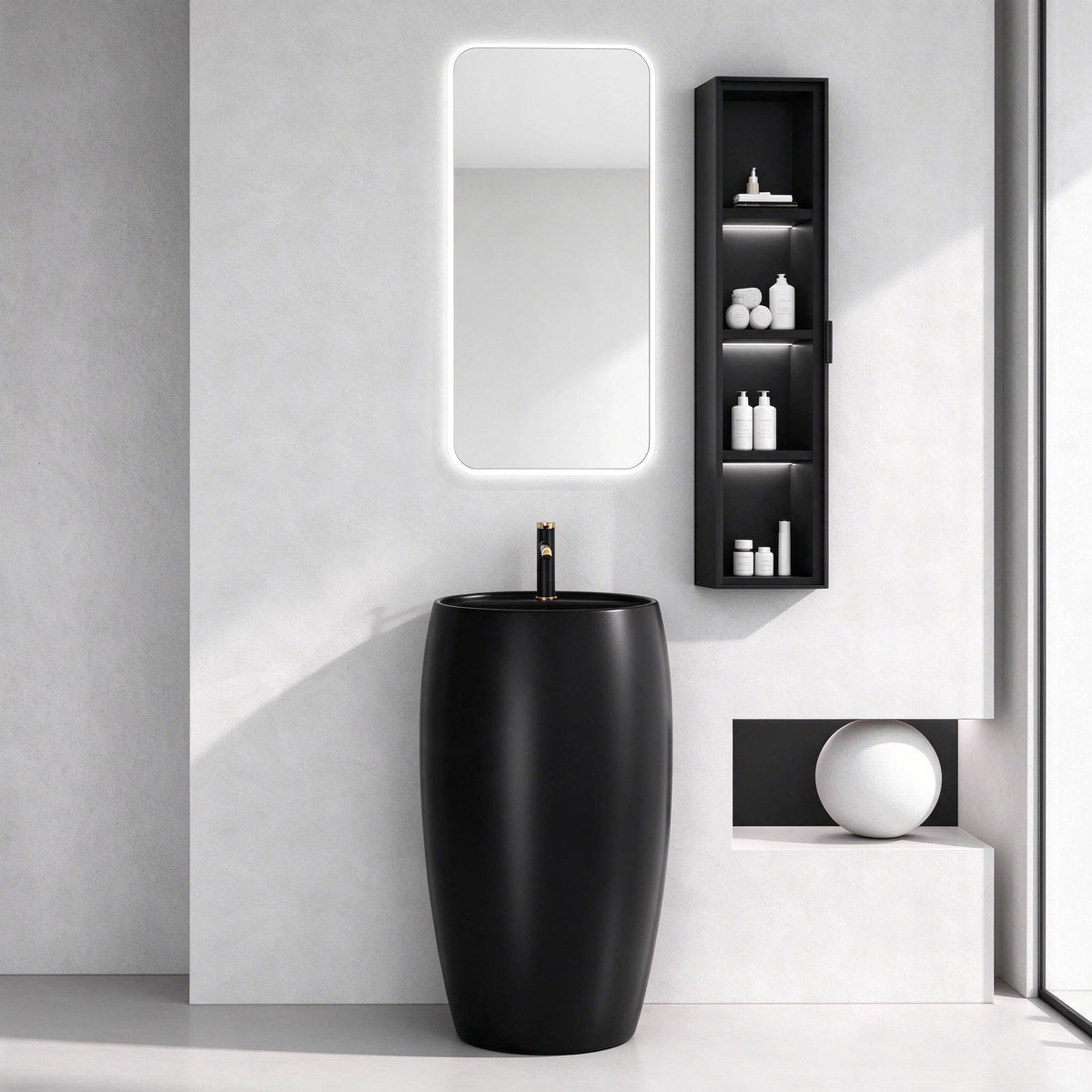 Black ceramic round pedestal bathroom sink in a modern bathroom