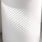 Close-up of the white stainless steel pedestal bathroom sink with decorative perforated pattern on the base