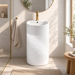 White stainless steel pedestal bathroom sink with a fan-shaped basin and cylindrical pedestal base in a modern bathroom