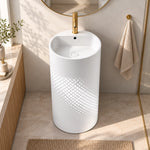 White stainless steel pedestal bathroom sink with fan-shaped basin and cylindrical base in a modern bathroom