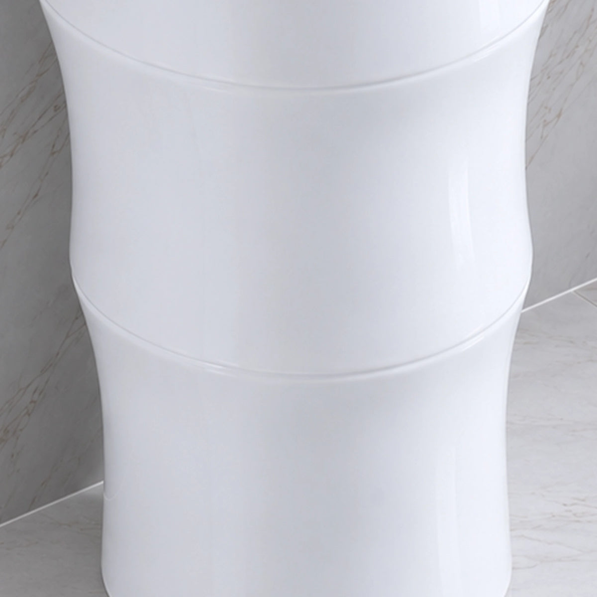 Close-up of the smooth white ceramic pedestal sink base
