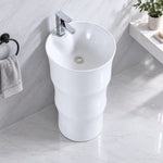 White ceramic oval pedestal bathroom sink with spacious oval basin and single-handle faucet
