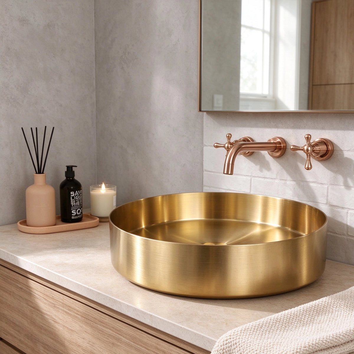 Gold stainless steel round vessel bathroom sink on a bathroom countertop