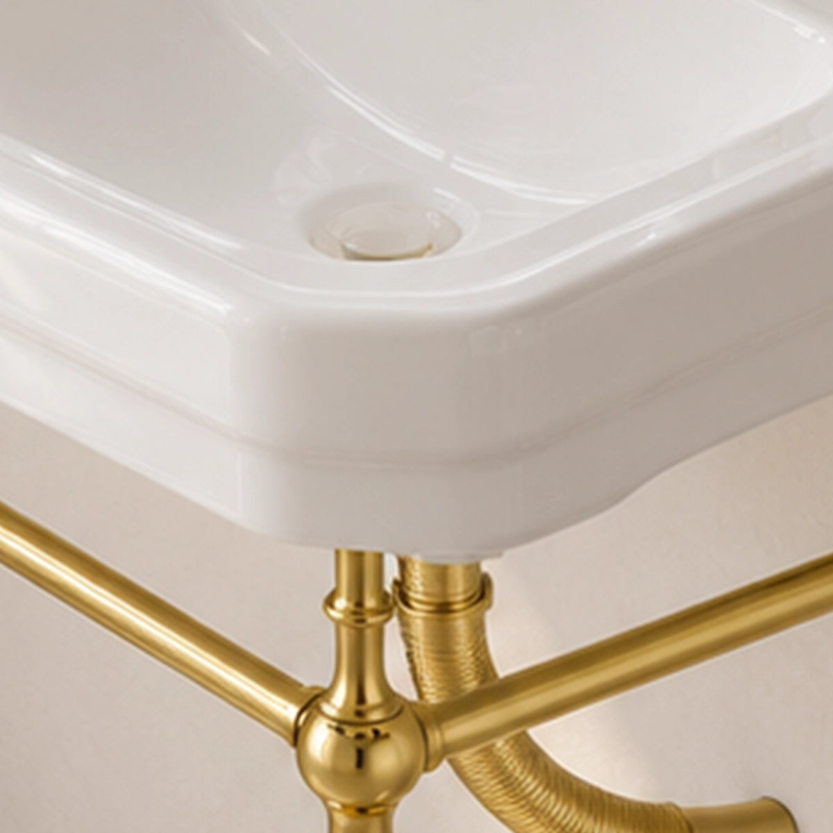 White ceramic rectangular console bathroom sink with gold-tone frame and three-hole faucet