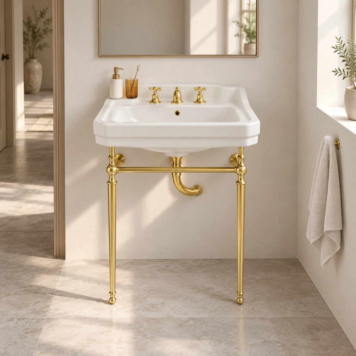 White rectangular console bathroom sink with gold-tone support frame and three-hole faucet in a modern bathroom setting