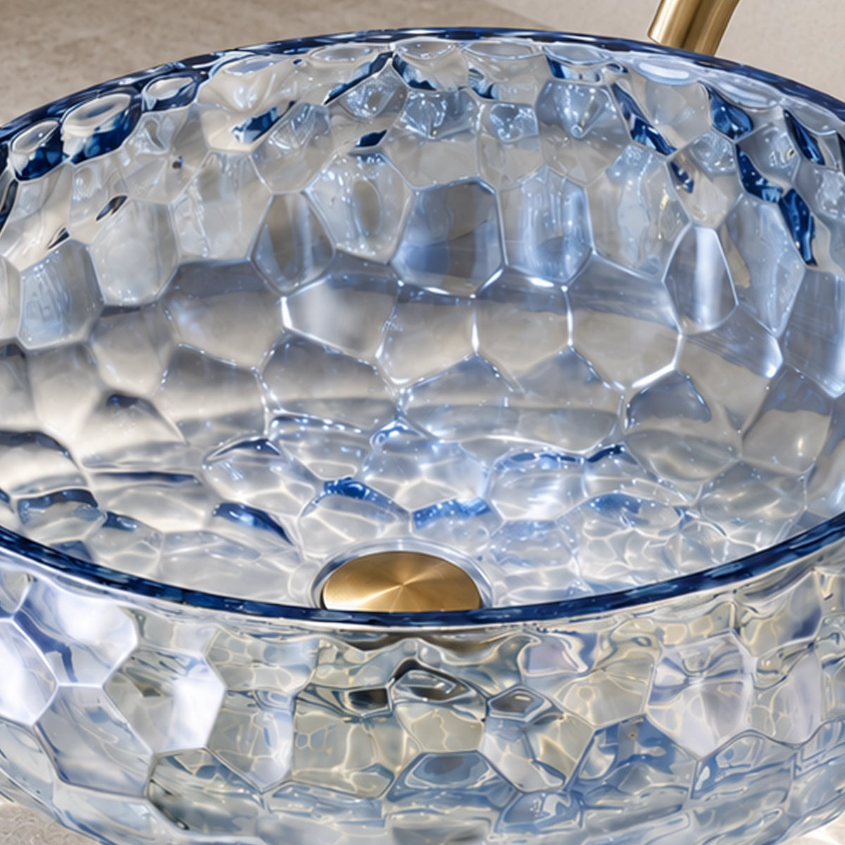 Blue glass round vessel bathroom sink with textured glass surface and visible drain opening