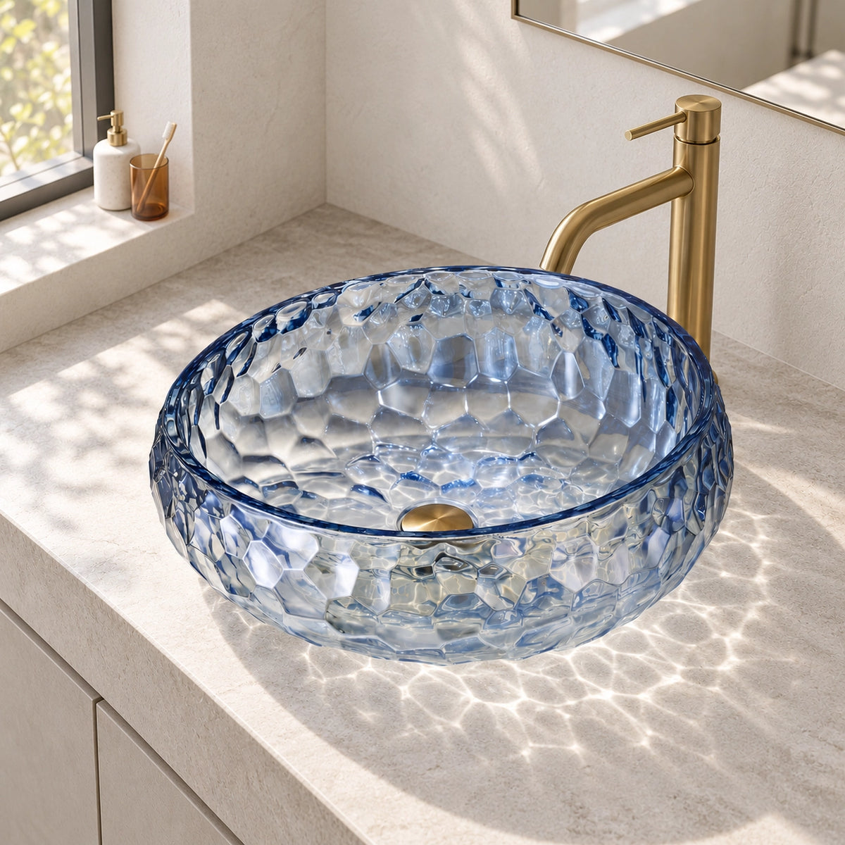 Blue glass round vessel bathroom sink with a textured surface and visible drain opening